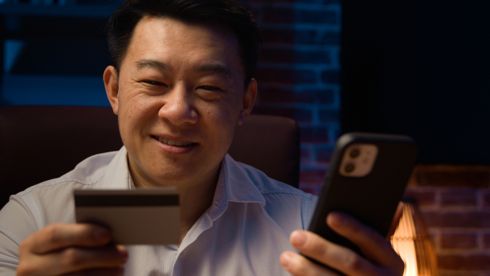 Smiling,Happy,Asian,Man,At,Dark,Night,Evening,Home,Office